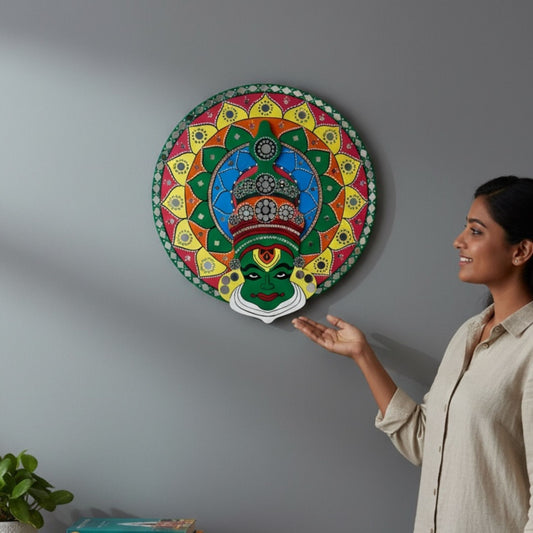 Woman admiring a 2ft round kathakali wall art piece on a gray wall