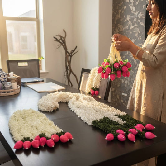Woman decorating a table with handcrafted jasmine lotus bud fabric garlands – set of 10 artificial Indian floral garlands for home decor