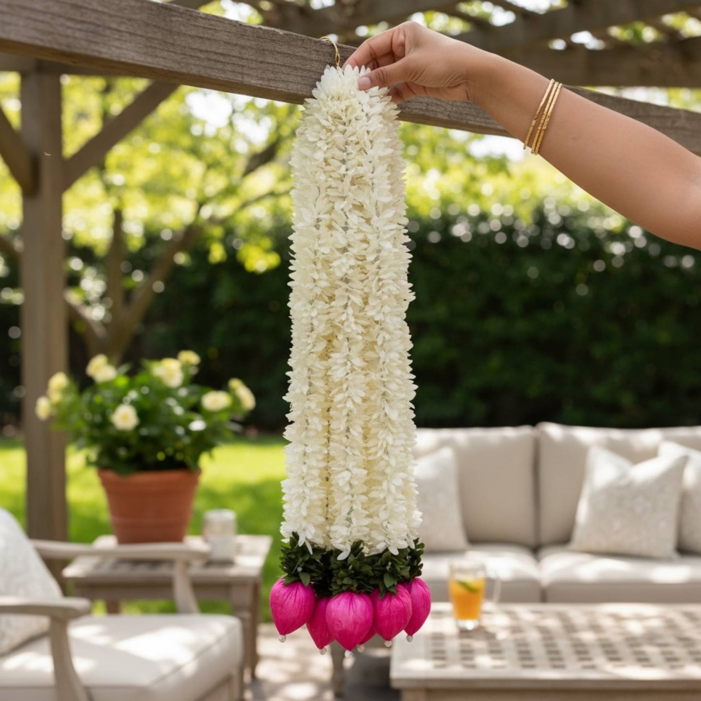 2ft long jasmine lotus bud artificial garland held outdoors – white fabric flowers with pink sola wood lotus buds, part of set of 10