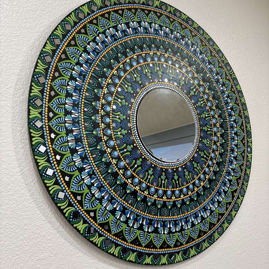 Hawaii Rainforest mandala mirror hung on a pale wall, showing its three-foot scale