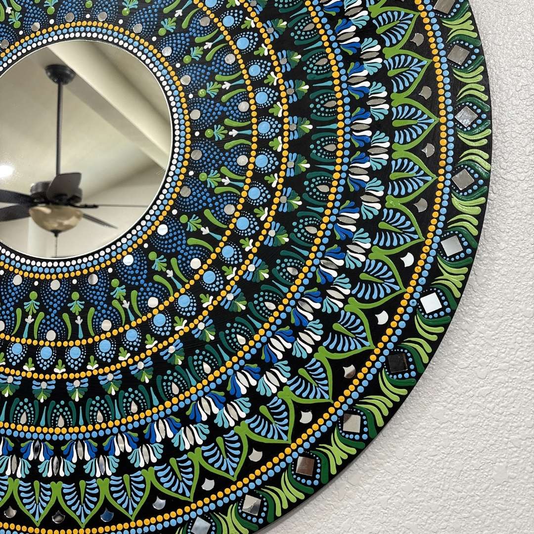 Hawaii Rainforest mandala mirror above a white fireplace mantel in a bright room