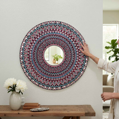 Hand adjusting handcrafted mandala mirror on wall, 36-inch Hawa Mahal design 
