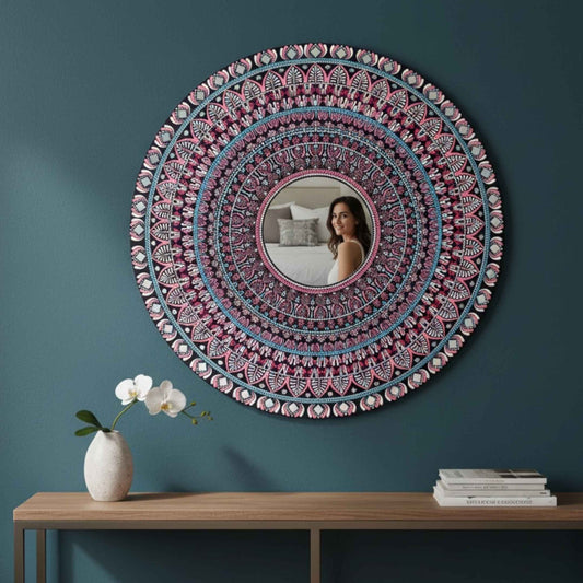 Mandala mirror wall art hung on teal wall above wooden console table decor