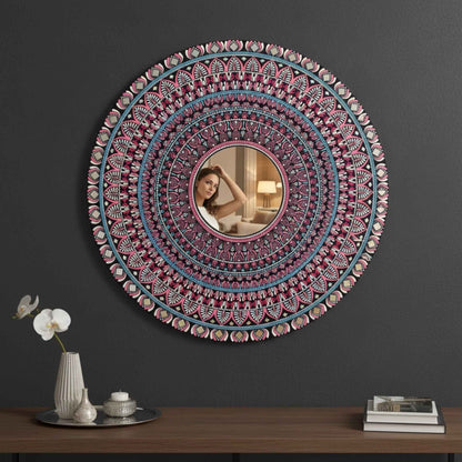 Intricate mandala mirror wall art mounted on dark wall above wooden furniture