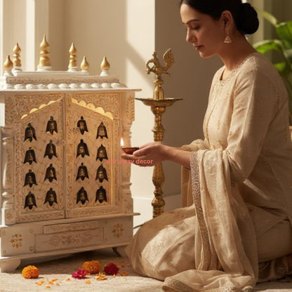 Woman performing a pooja in front of  Urli Utsav Mandir