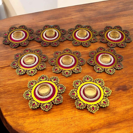 Decorative candle holders on a wooden surface