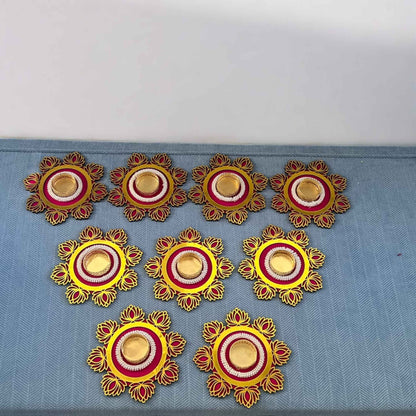 Decorative elements with yellow, red, and gold colors on a blue fabric background