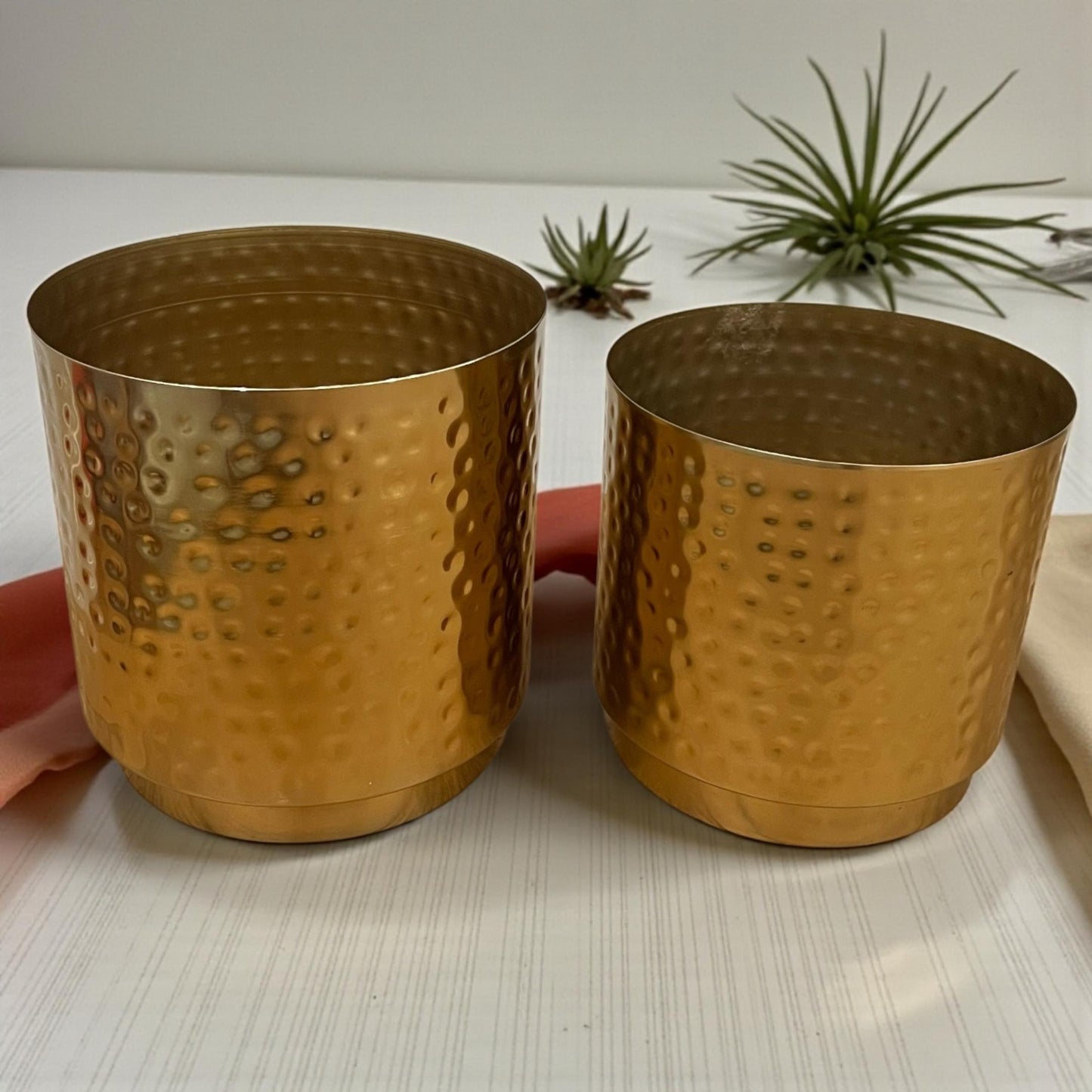 Empty gold hammered metal pots showing the spacious 8x8x8 and 7x7x7 interior for various plant types.