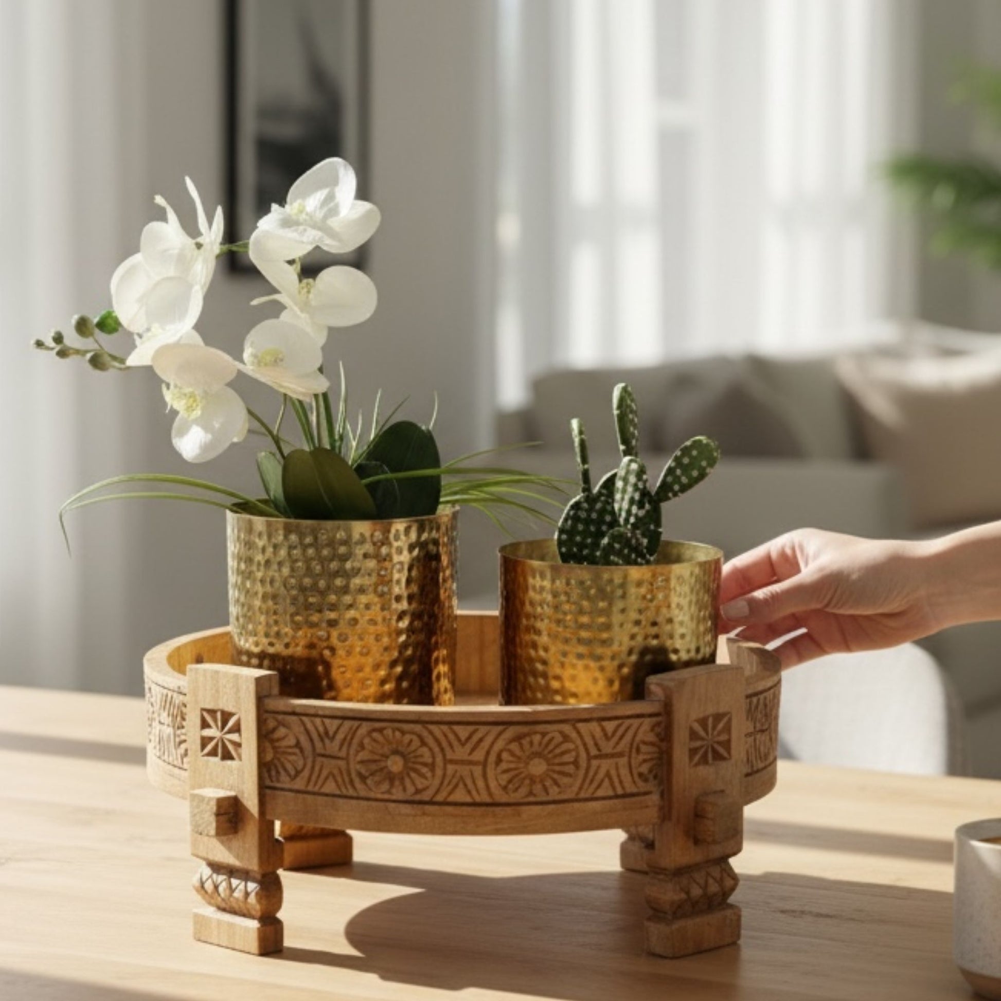 Traditional decor setup featuring gold metallic planters paired with neutral tones and bohemian accents.