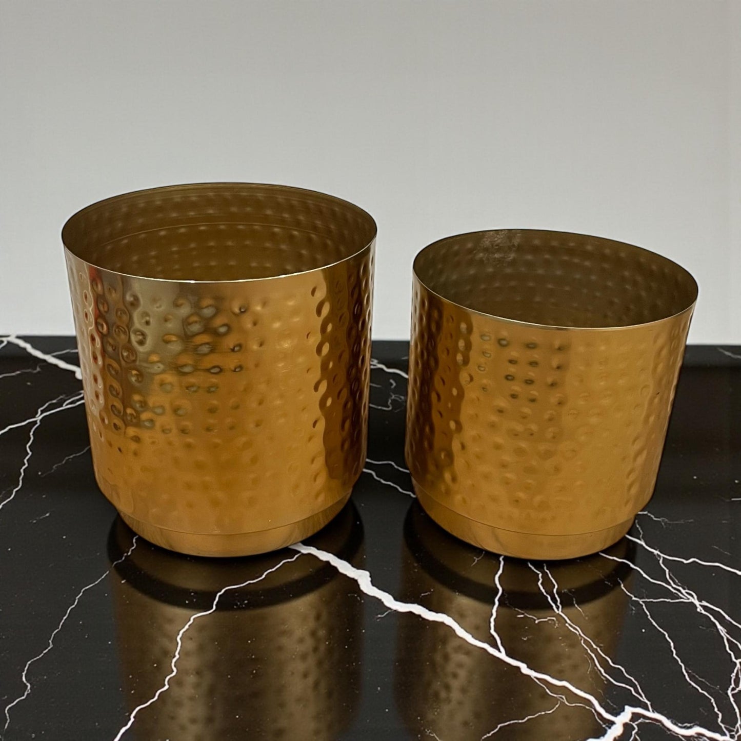 Set of 2 gold hammered metal planters in 8-inch and 7-inch sizes for modern home decor