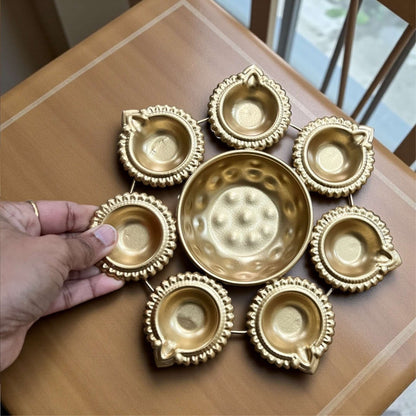 8-inch diameter mini gold Urli bowl perfect for tabletop or pooja room display.