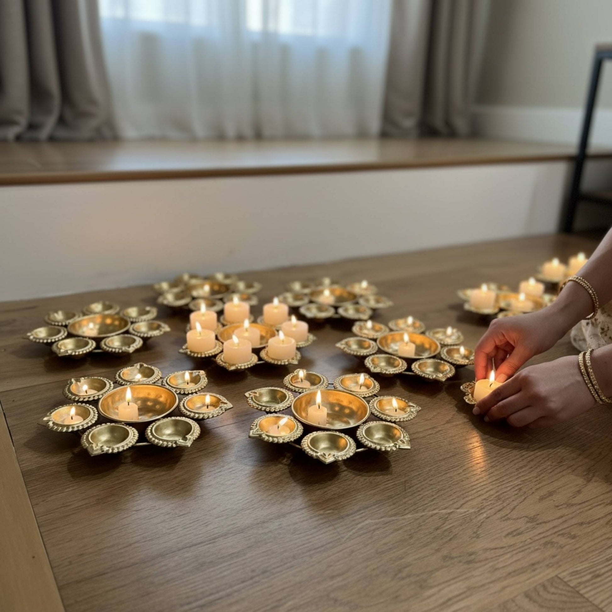 Handcrafted iron metal Urli bowls in a set of 10 for desi wedding favors and mehndi giveaways.