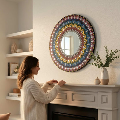 Woman standing in a room with a Multicolor Mandala Lippan Mirror Wall Art above a fireplace.