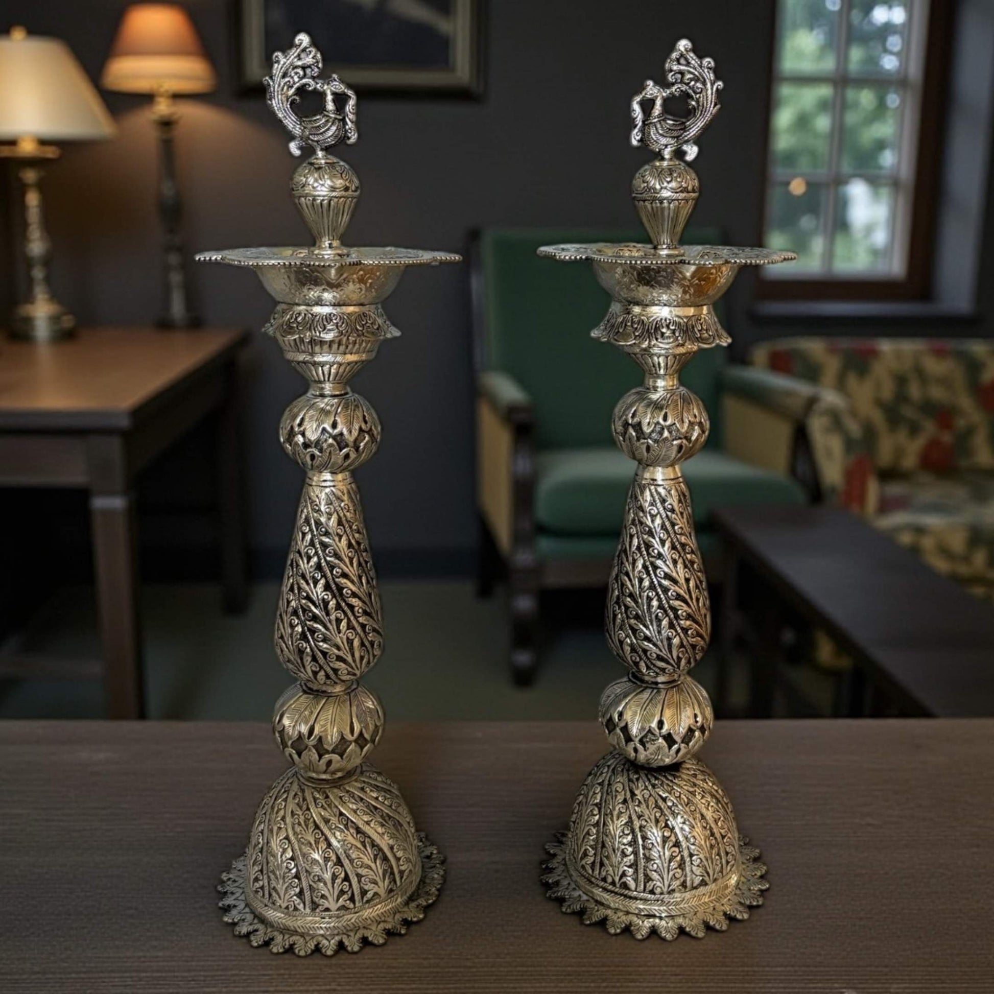 28-inch antique silver Nilavilakku oil lamp with intricately engraved peacock motif 