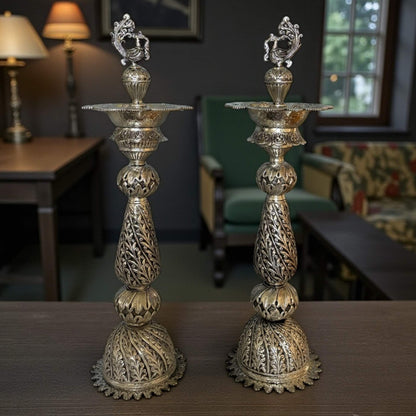 28-inch antique silver Nilavilakku oil lamp with intricately engraved peacock motif 