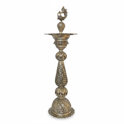 front angle view of 28-inch silver peacock samai oil lamp pair with detailed traditional engraving