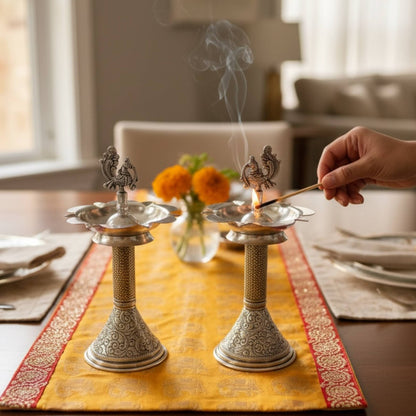 Decorative metal incense burners with silver samai oil lamp visible