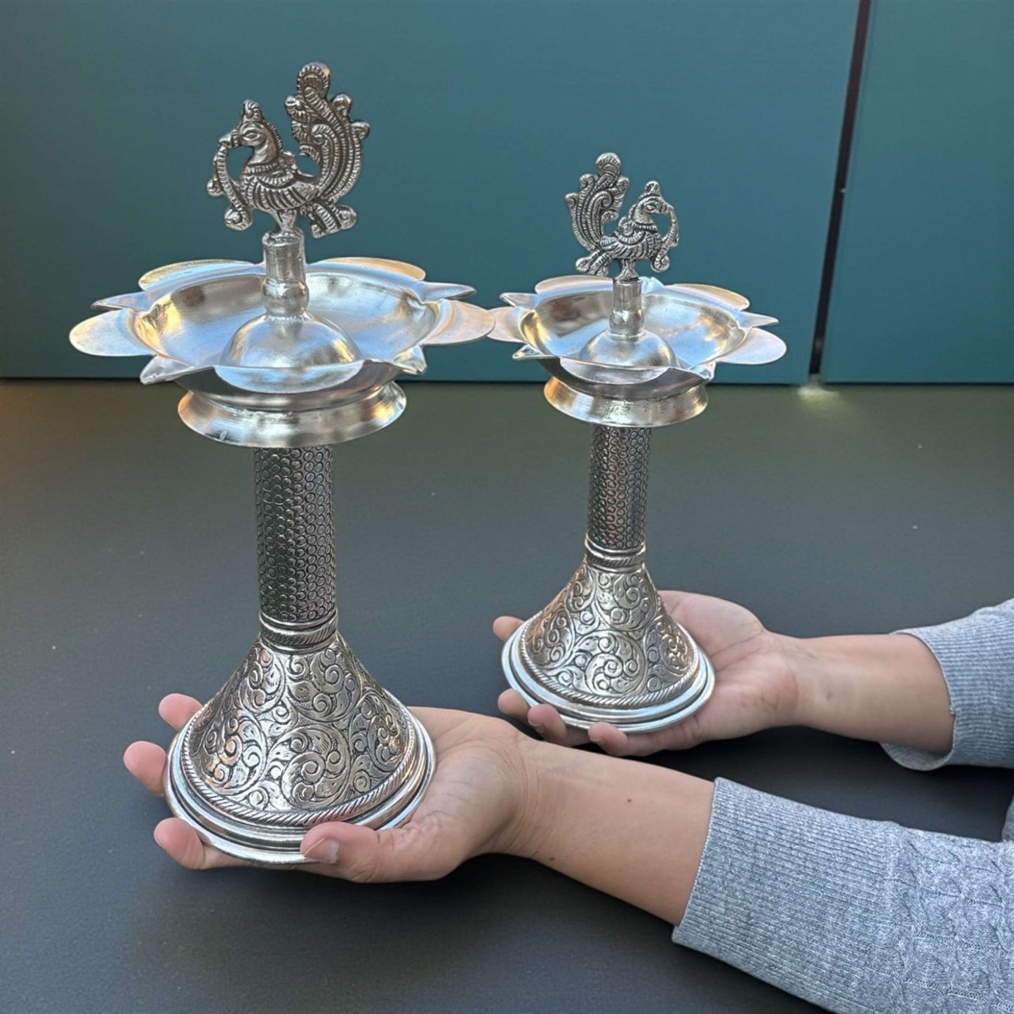 Pair of 11-inch antique silver peacock samai oil lamps front view