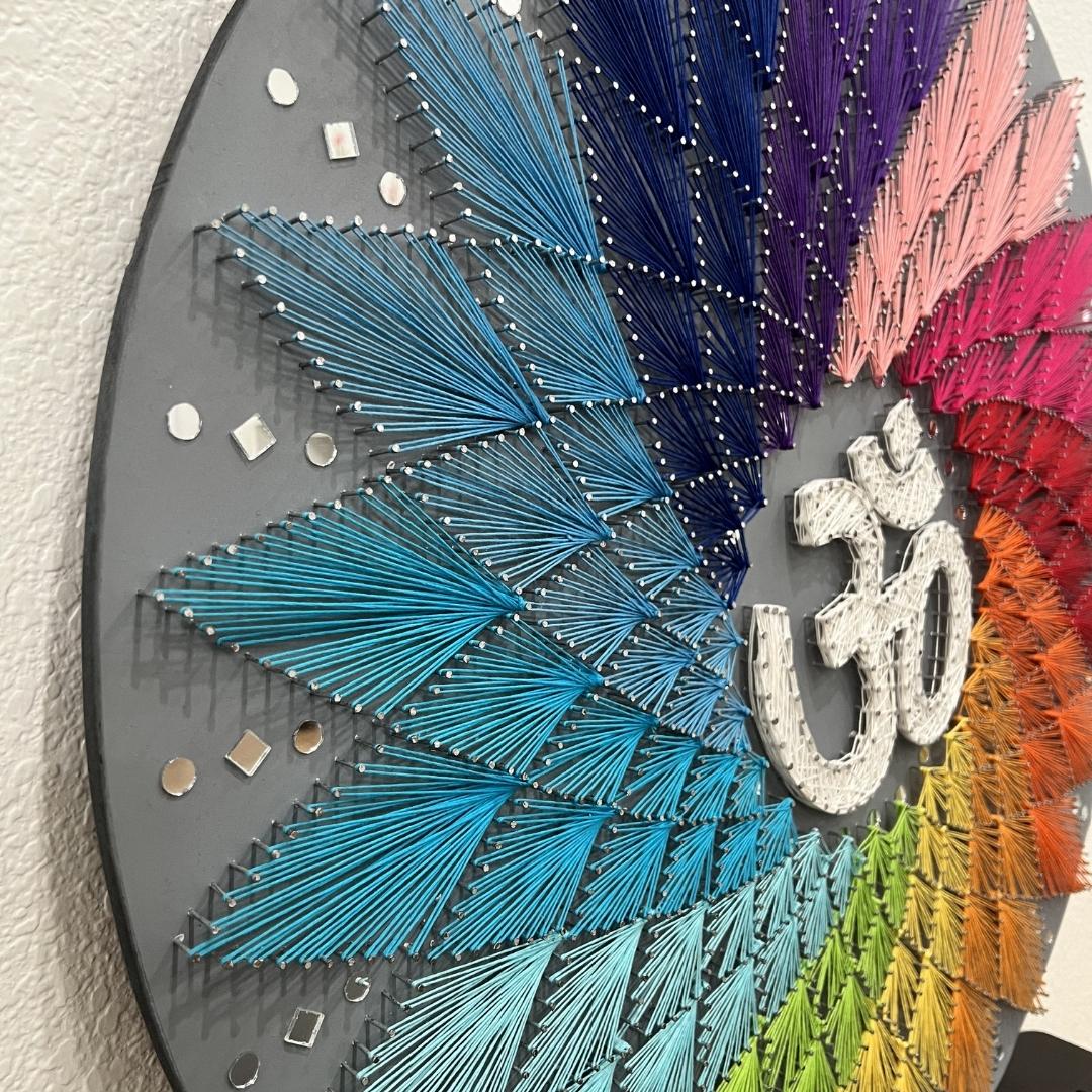 Side angle displaying the depth and texture of the 30-inch Om string art, emphasizing its three-dimensional appearance
