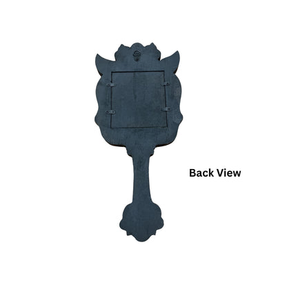 Back view of hand-carved South Indian wooden mirror showing sawtooth wall-mount hook