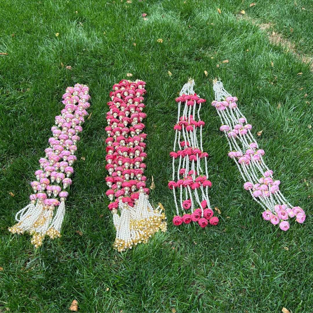 Peony Flower Pearl Garland Set - 4 Designs displayed on the grass