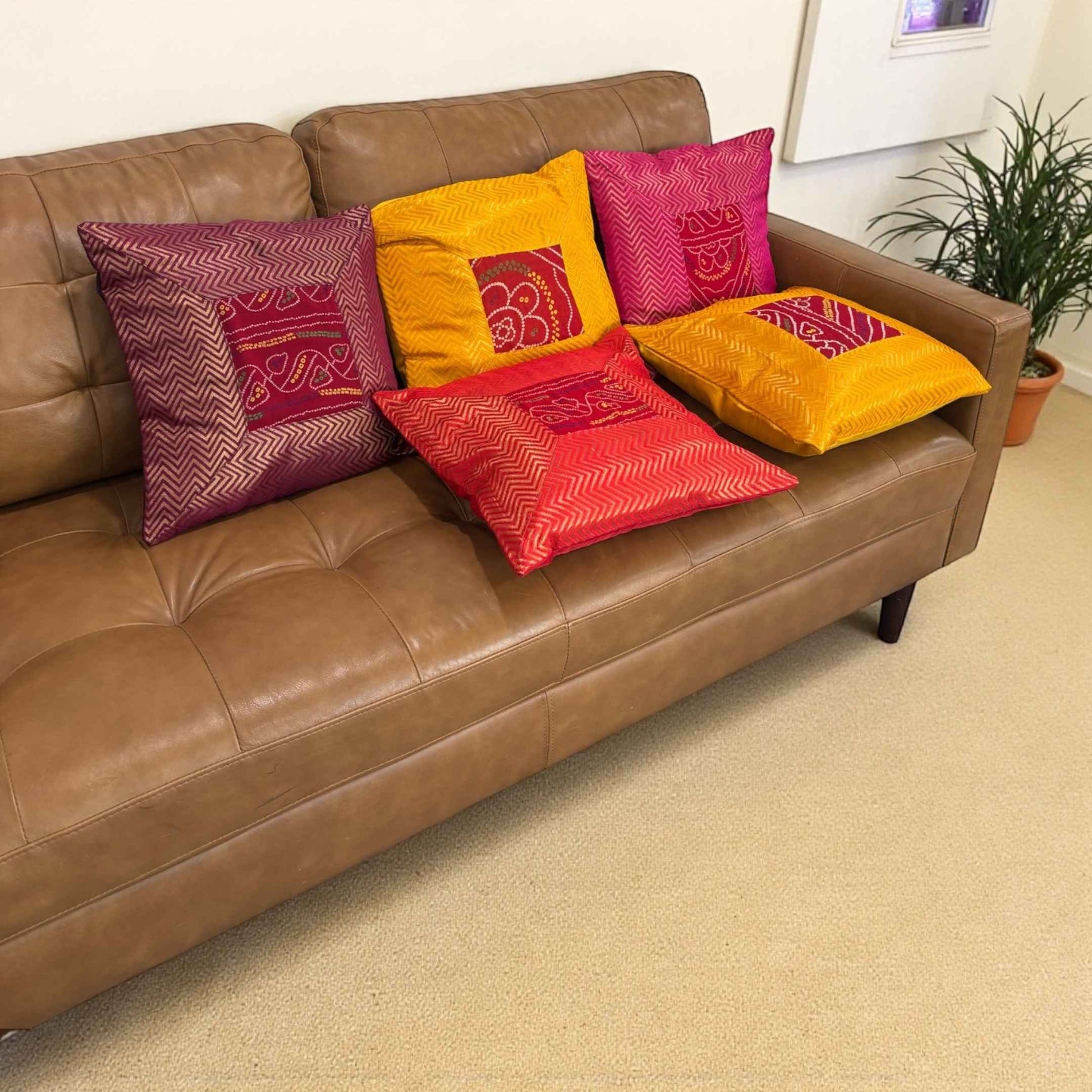 Boho living room with 5-piece Bandhani silk brocade cushion cover set (16×16) — vibrant Diwali home decor