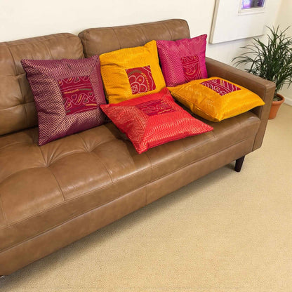 Boho living room with 5-piece Bandhani silk brocade cushion cover set (16×16) — vibrant Diwali home decor