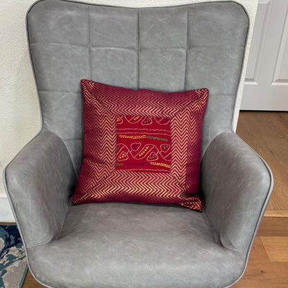 Brown 16×16 Bandhani silk brocade cushion cover on chair — vibrant Diwali decor accent, handcrafted.