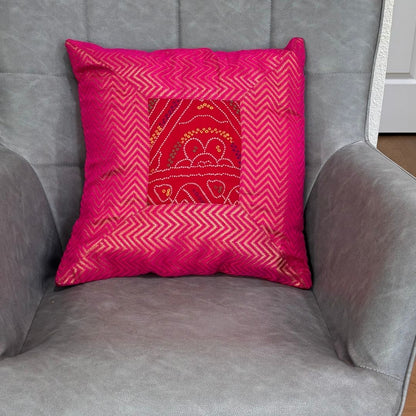 Pink 16×16 Bandhani silk brocade cushion cover on chair — vibrant Diwali decor idea