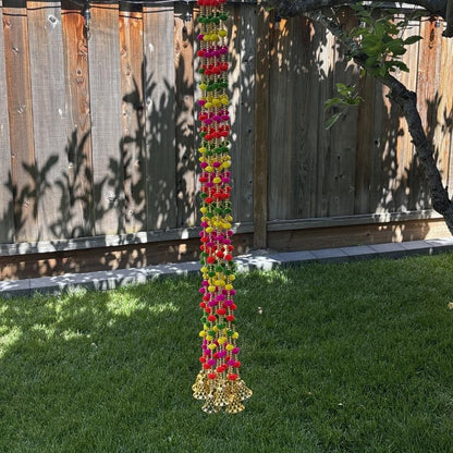 Vibrant artificial pompom garland with golden beads for Indian wedding decor