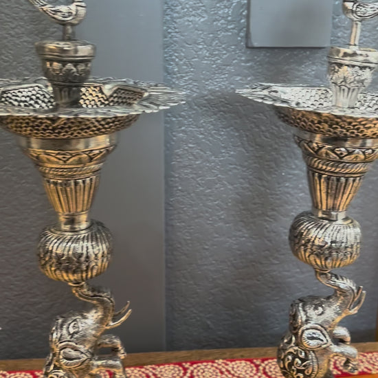 Video of German silver antique silver samai oil lamps with peacock and elephant base – Urli Utsav decor