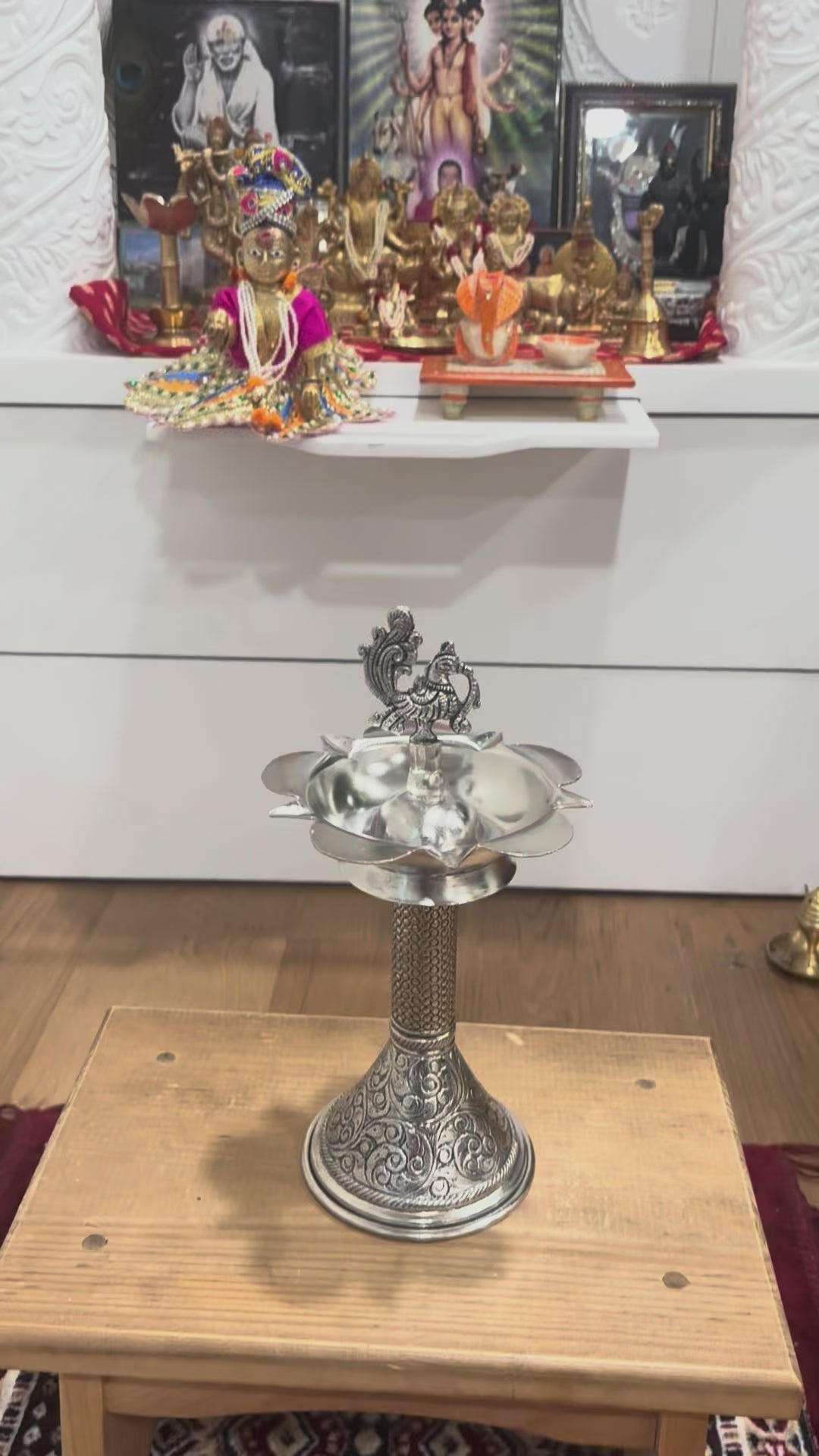 Video preview thumbnail showing 11-inch peacock samai oil lamps in antique silver finish