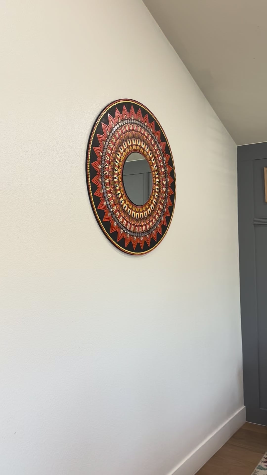 Video preview of 3ft round mandala mirror in black and orange colors