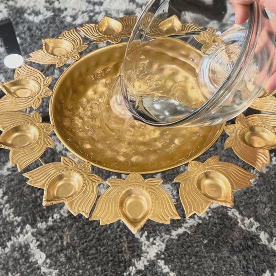 Short video showcasing the gold lotus urli set as a festive home entrance centerpiece.