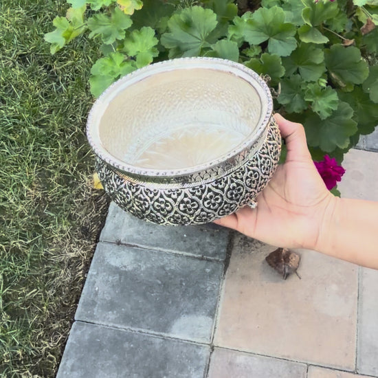 Video thumbnail of handcrafted Urli Utsav 7.5-inch flower engraved antique silver urli bowl demonstrating german silver finish and detailing