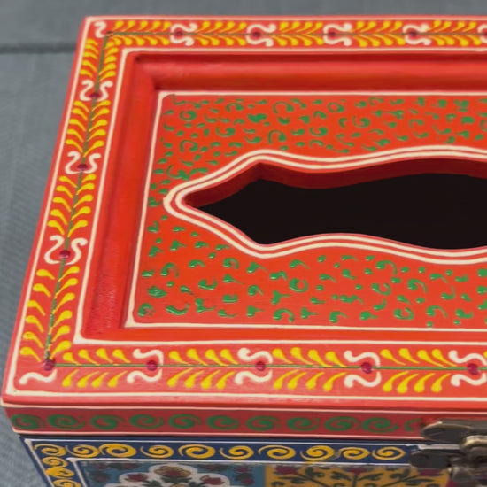 Video of Handcrafted mango wood tissue box with hand-painted Rajasthani floral art, brass latch & wooden feet.
