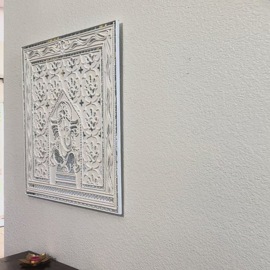 Video of Decorative Ganesha Lippan wall art with intricate design on white wall