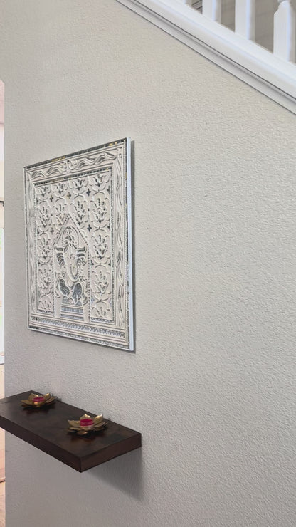 Video of Decorative Ganesha Lippan wall art with intricate design on white wall