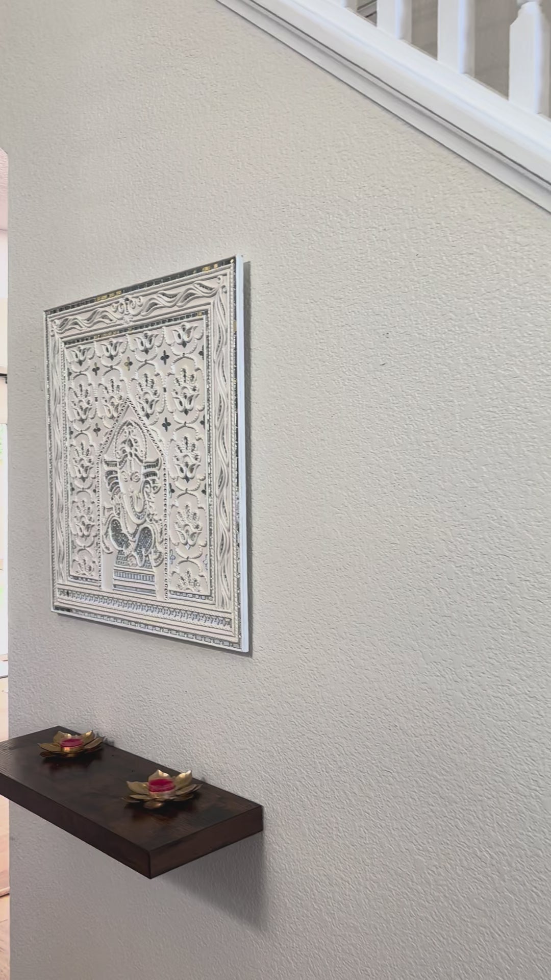 Video of Decorative Ganesha Lippan wall art with intricate design on white wall