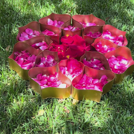 video of Handmade golden lotus etched urli plate with 17 compartments. Perfect for home décor, weddings, and festive celebrations. Free USA shipping.