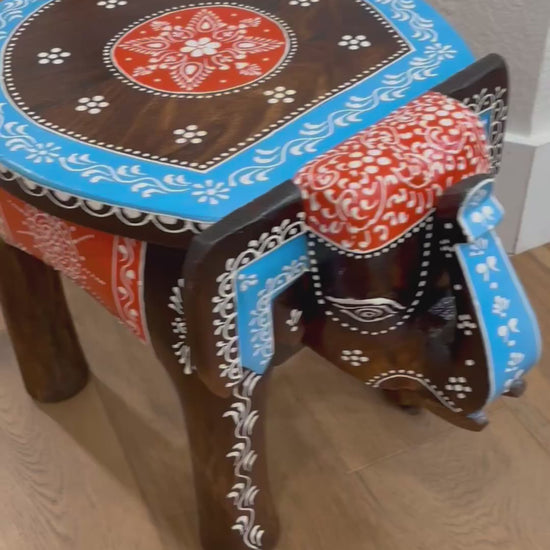 Side Table - Display furniture video, Close-up of intricately carved elephant legs supporting the boho-style wooden side table