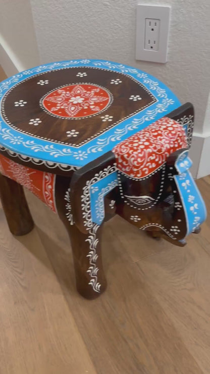 Side Table - Display furniture video, Close-up of intricately carved elephant legs supporting the boho-style wooden side table