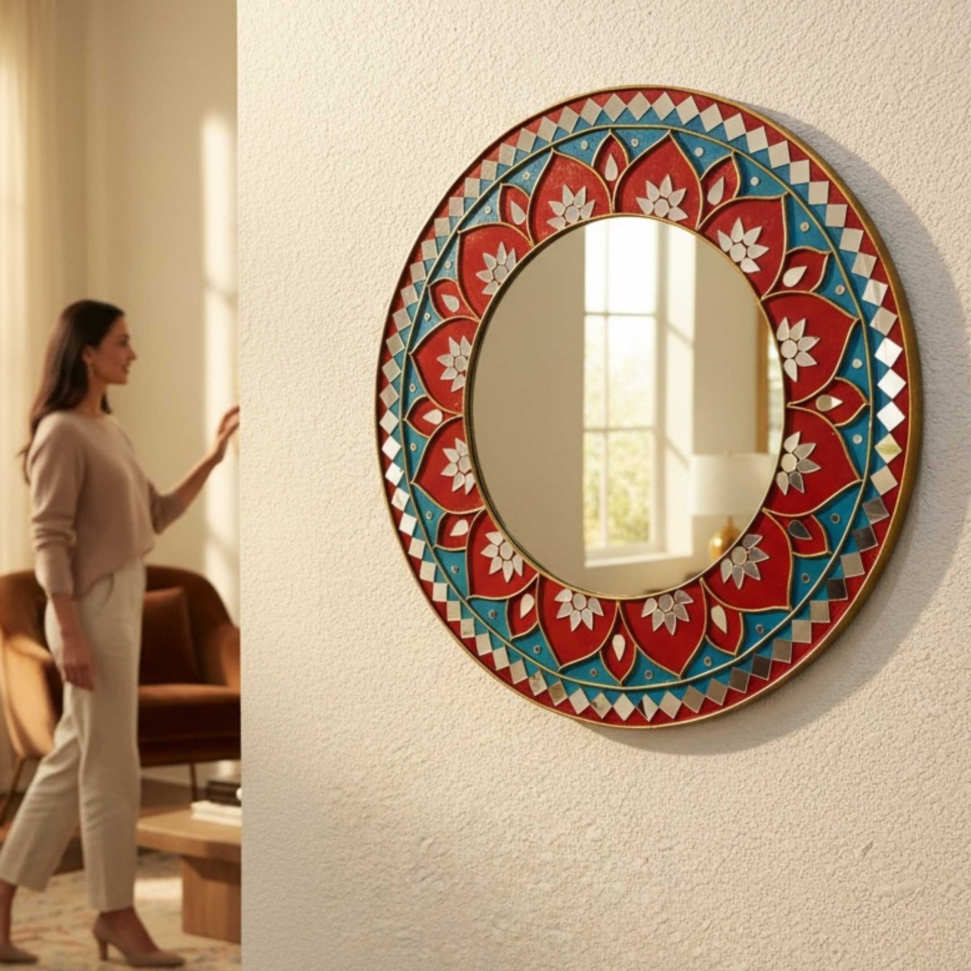 2ft red lippan mandala round mirror with a colorful floral frame on a wall