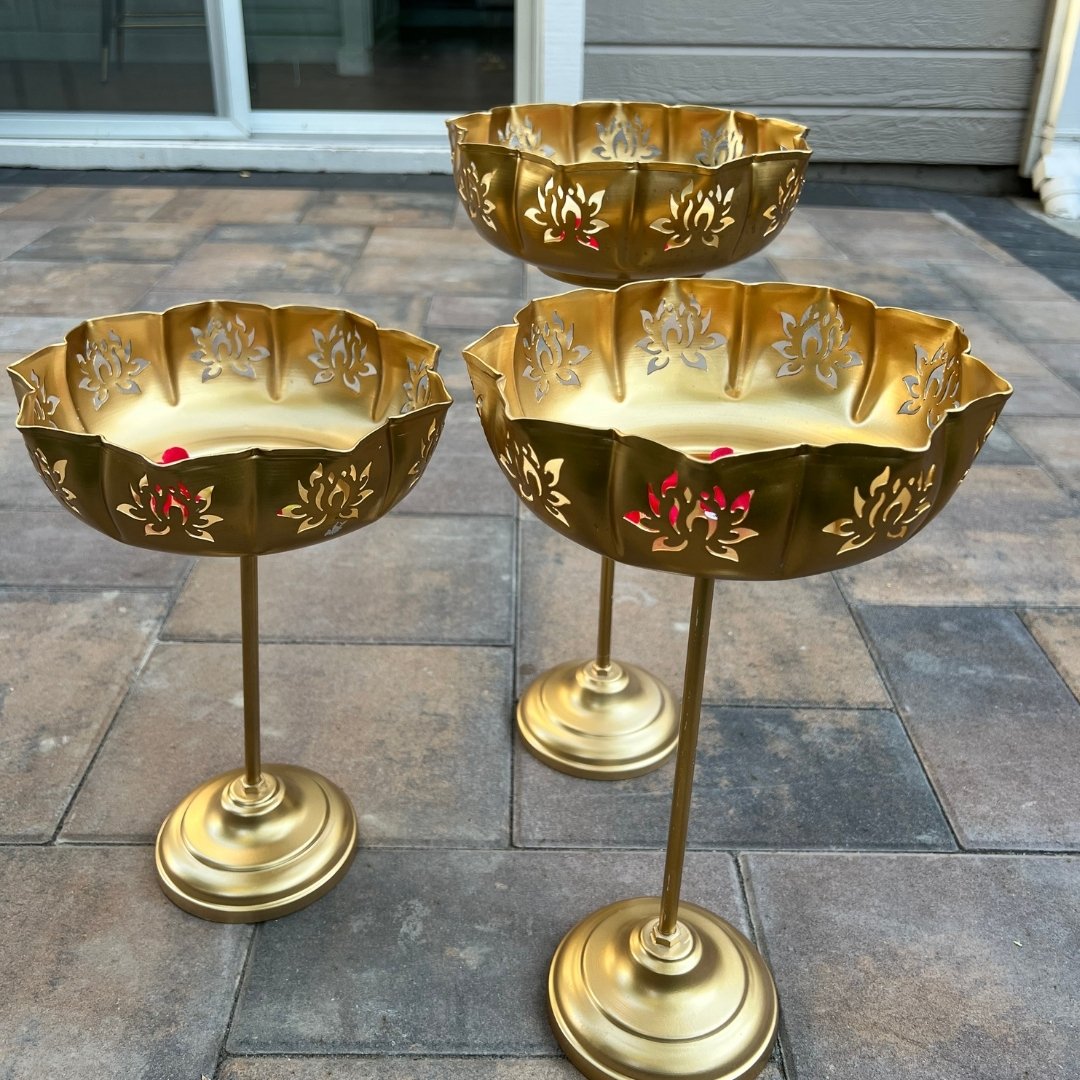 op-down view: Gold Lotus Motif Urli by Urli Utsav Decor with floating petals — ideal Diwali decor, pooja bowl and dining centerpiece