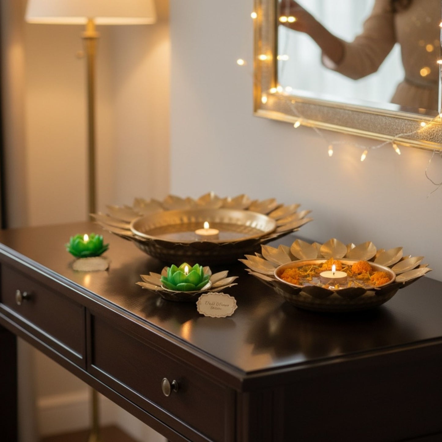 Decorative gold sunflower urli bowls styled as centerpiece décor with reflections
