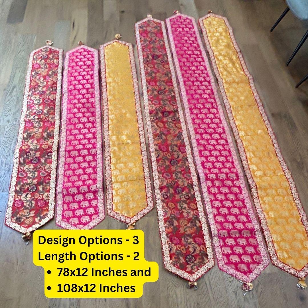 Decorative table runners with elephant patterns on a wooden floor.