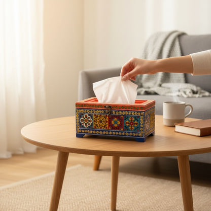 Handpainted wooden tissue box holder on coffee table with tissue being pulled, boho living room decor