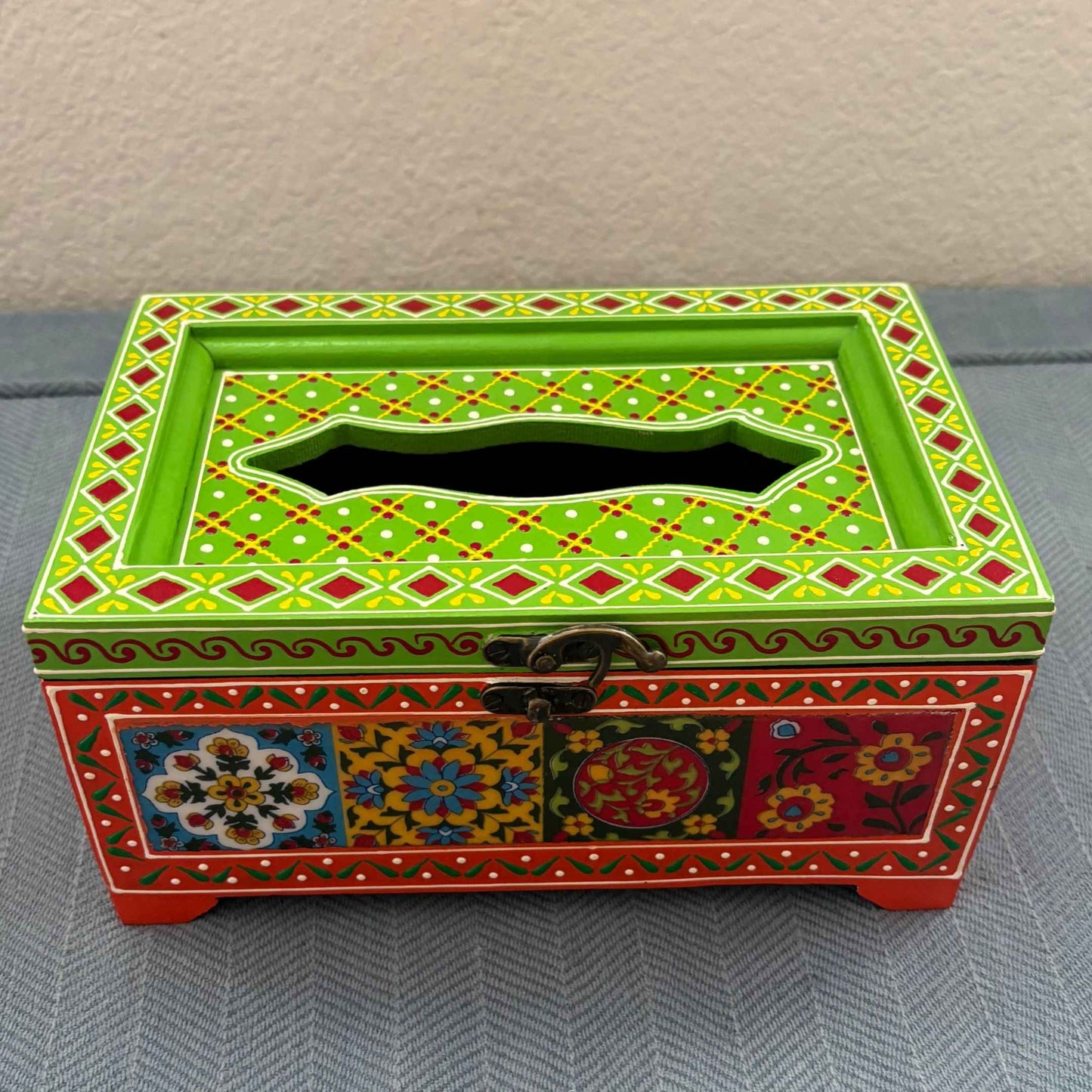 Handpainted mango wood tissue box with green lid and red base, Rajasthani floral pattern detail