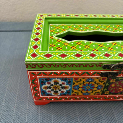 Close-up of green and red handpainted mango wood tissue box, Rajasthani floral tile detail