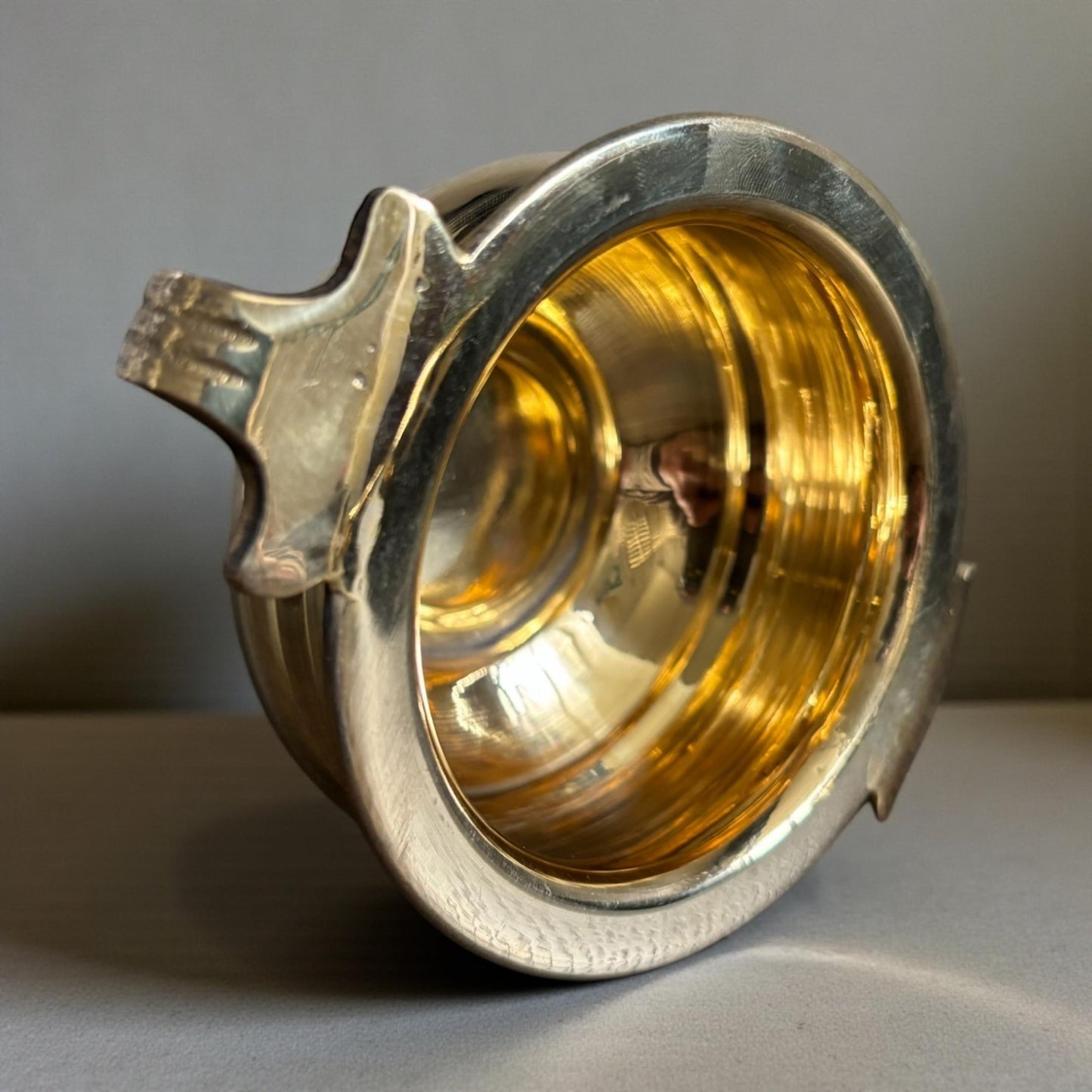 Top view of shiny brass interior of mini urli bowl – handcrafted pooja bowl design